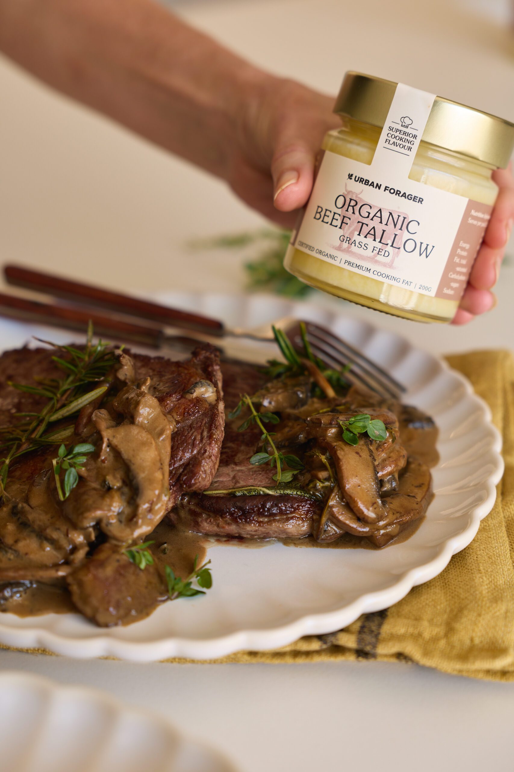 Image of creamy mushroom sauce served with steak and made with organic beef tallow and beef stock